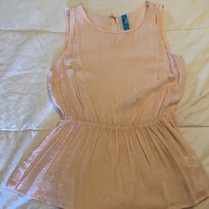 Light pink sleeveless top.